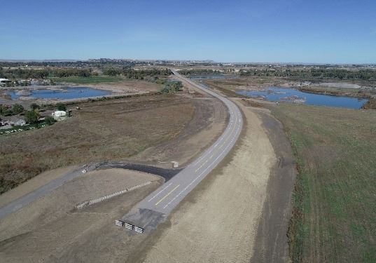 The new section of road will connect new river crossing with upcoming railroad and Coulson Road