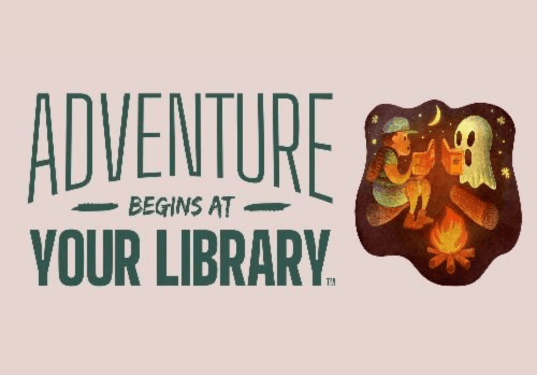 Photo of boy reading a book at a campfire, seated on a log across from a ghost reading a book