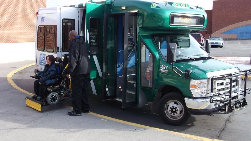 Green Para Transit bus using with driver using the lift